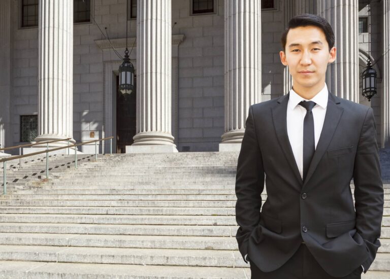 lawyer standing outside of courthouse