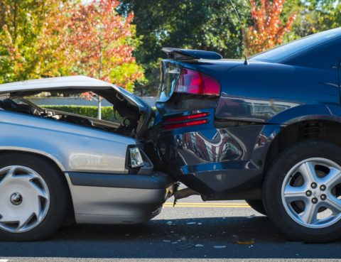 auto accident involving two cars on a city street