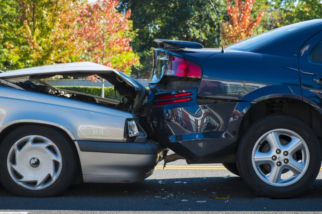 auto accident involving two cars on a city street